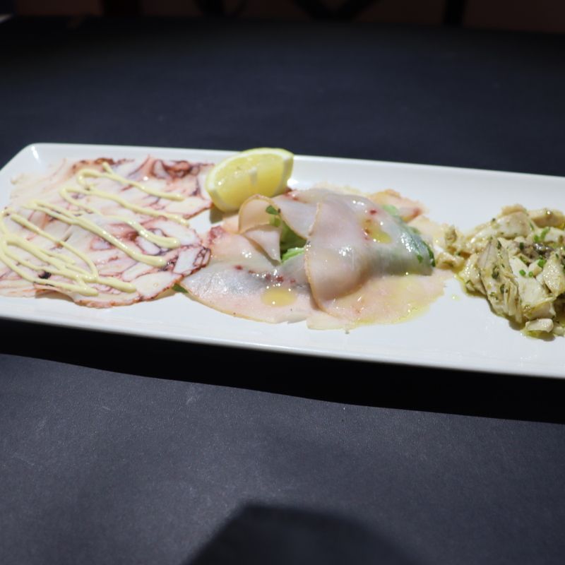 Tris di pesce: luccio in salsa, carpaccio di pesce spada, carpaccio di piovra