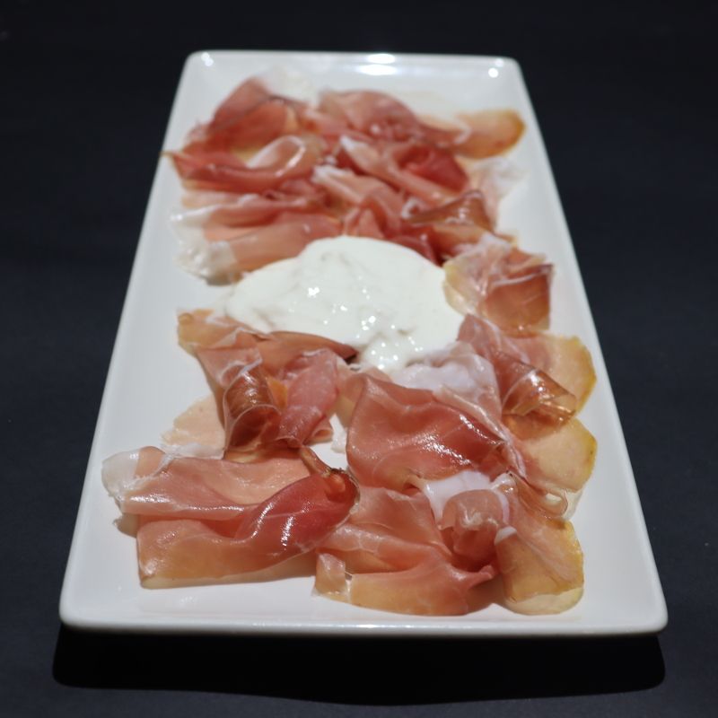 Raw Montagnana ham with burrata stracciatella