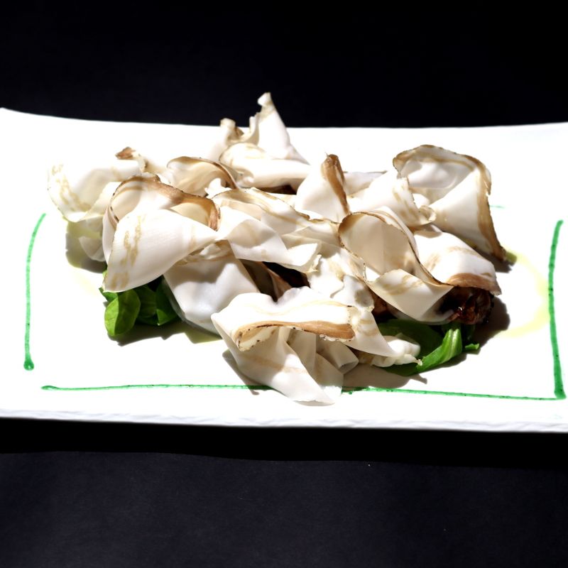 Sliced beef steak with lard of Colonnata