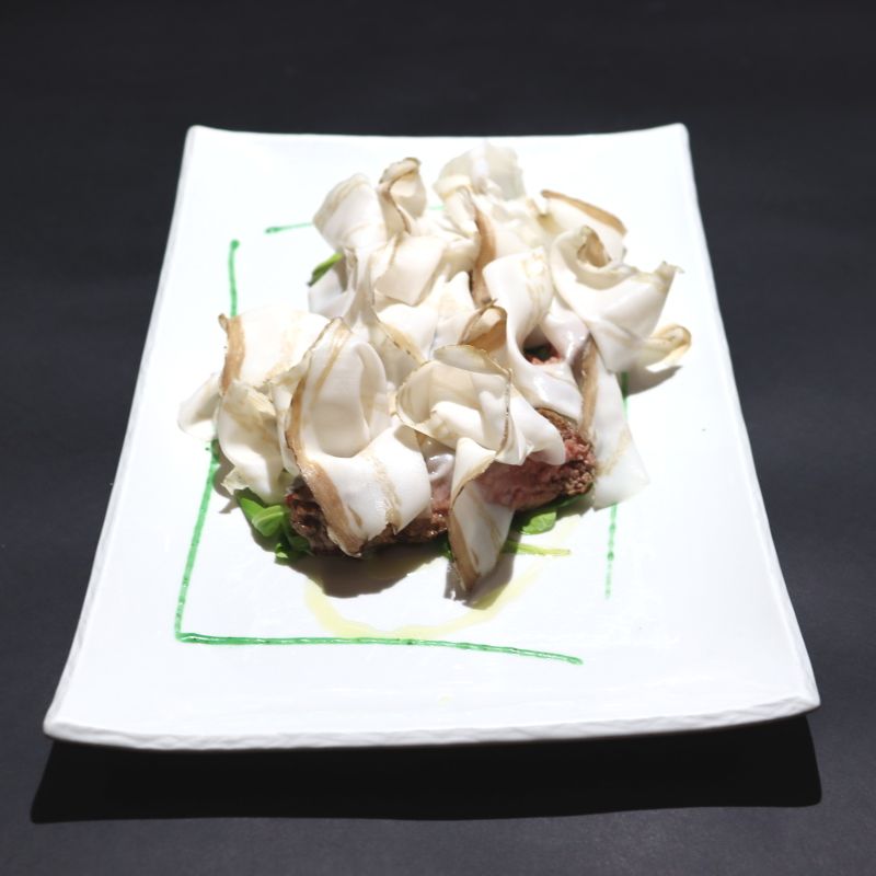 Sliced beef steak with lard of Colonnata