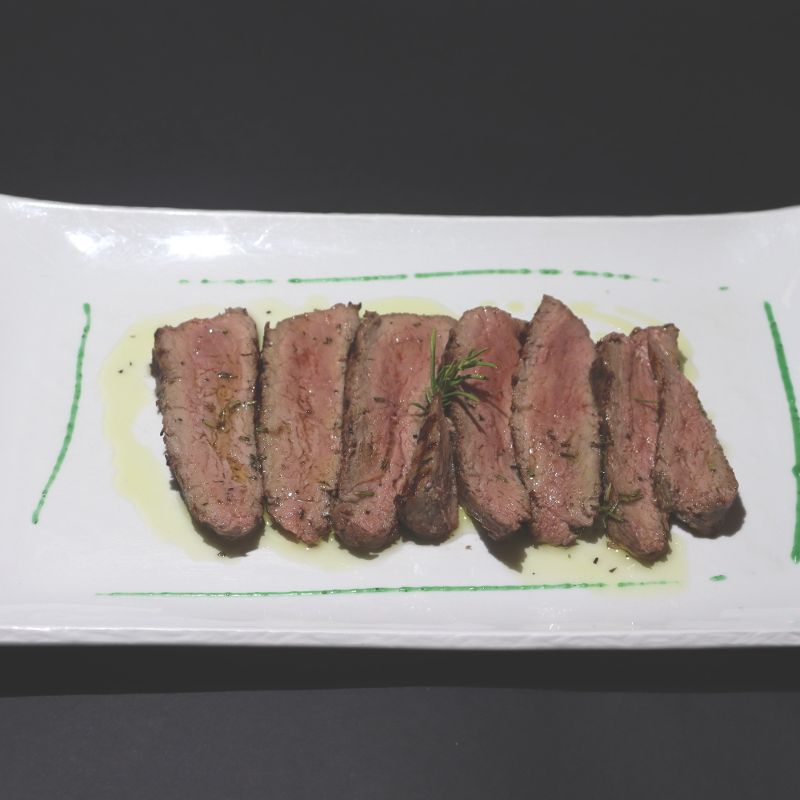Sliced beef steak with rosemary