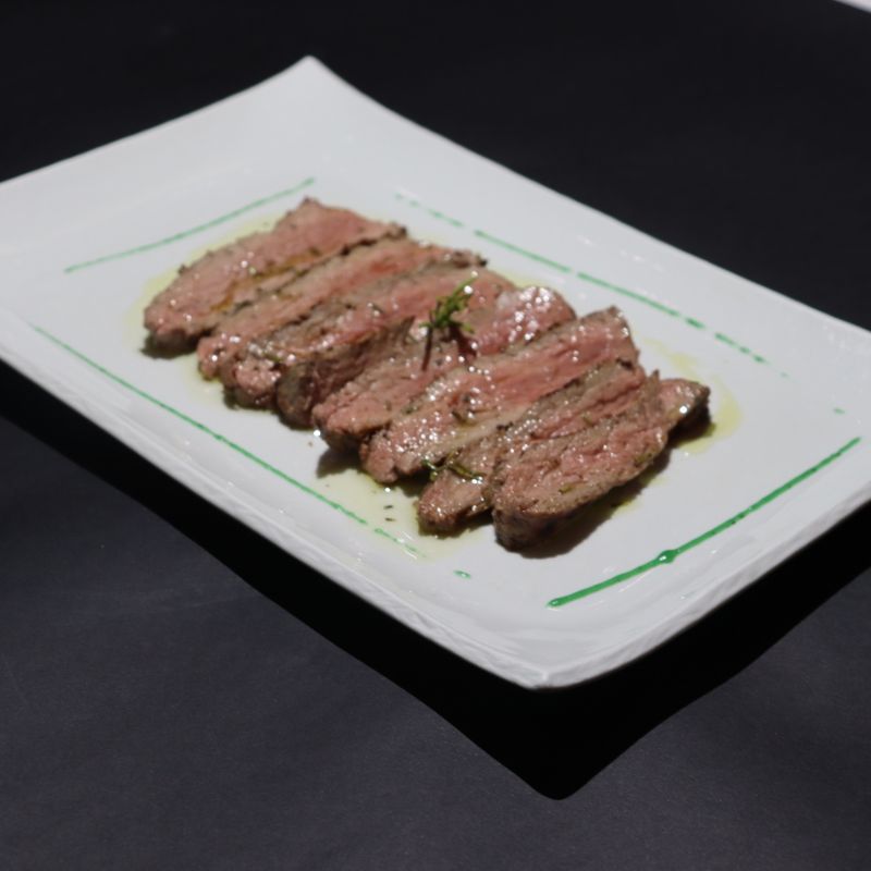 Sliced beef steak with rosemary